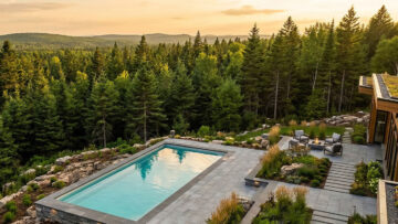 Earthworks fiberglass pool installation with modern stone pavers in Fredericton New Brunswick